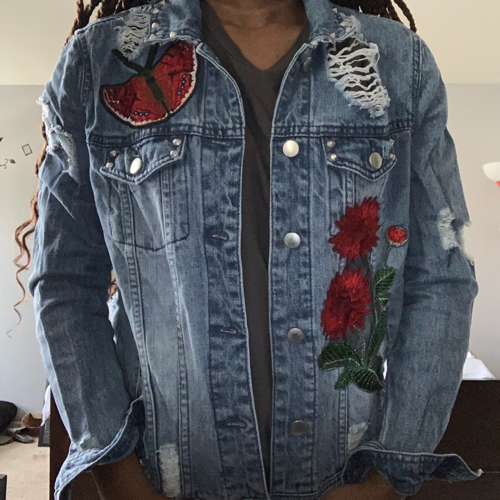 A Jean Jacket with Stitched pictures